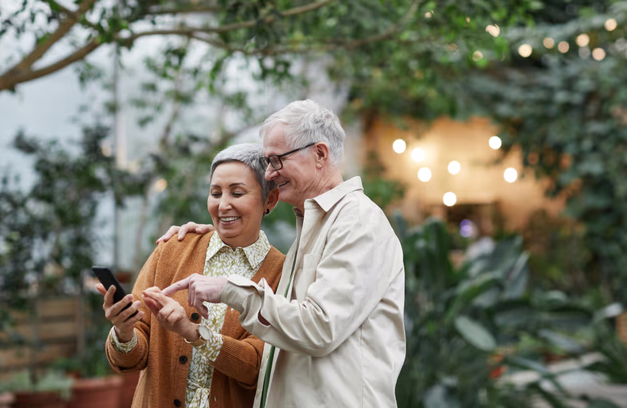 Old couple using a phone