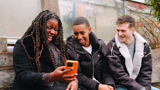 diverse friends using a phone